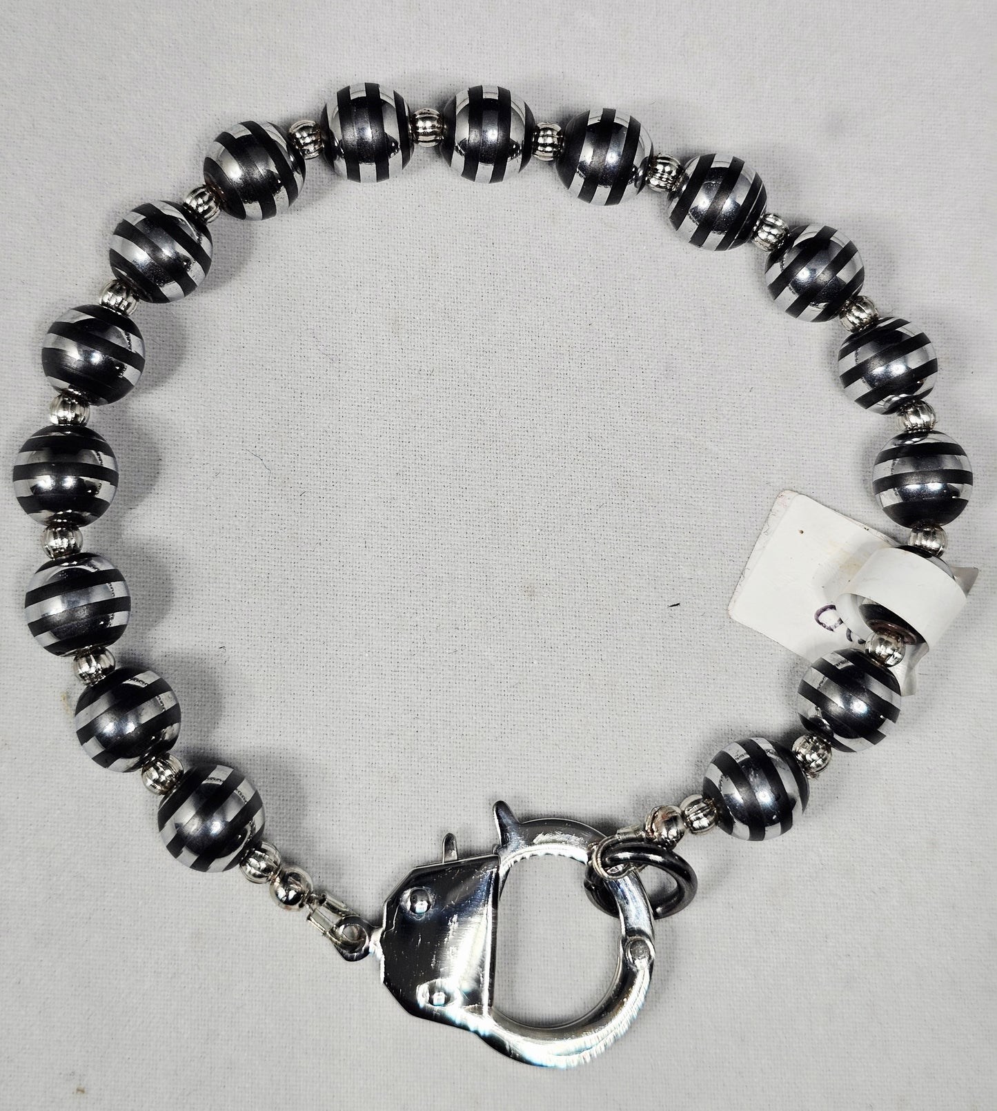 Silver Stripe Hematite Metal Bead Bracelet with Silver Spacers and a Handcuff Clasp