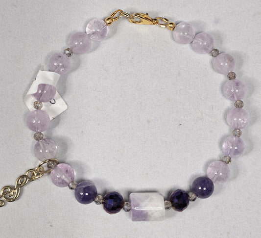 Amethyst Bead Bracelet Accented with a Amethyst Barrel Bead and Purple Faceted Bead along with a Gold Plated Music Note Charm