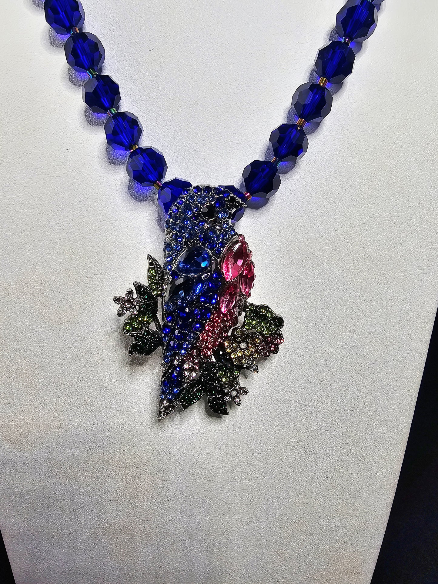 Beautiful Rhinestone Parrot Pendant Necklace with Cobalt Blue Faceted Beads and Rainbow Hued Accent Beads and Clasp