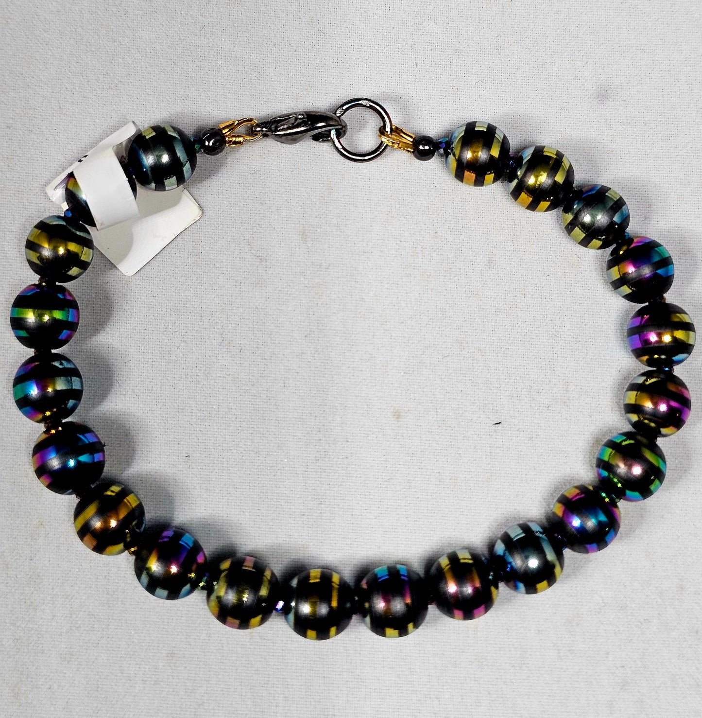 Rainbow Stripe Hematite Bead with Rainbow Faceted Spacer beads and Rainbow Lobster Clasp